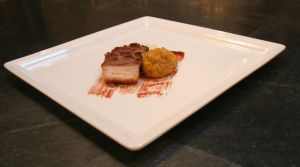Fried matzo ball served with Manischewitz wine-glazed pork belly and Jerusalem artichoke puree.
